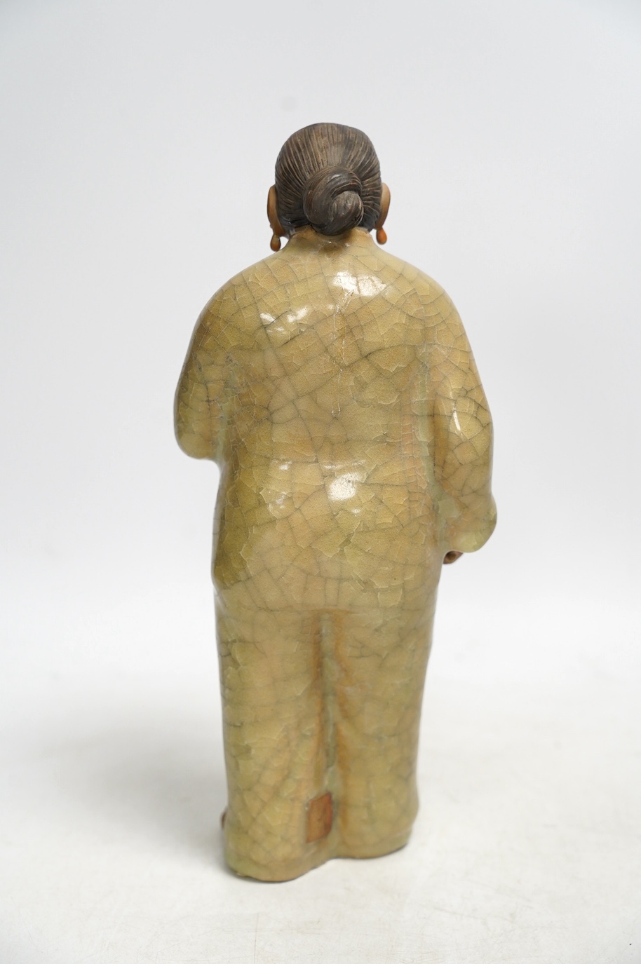 A Chinese Shiwan figure of a woman, mid 20th century, with box, 28cm high. Condition - poor to fair